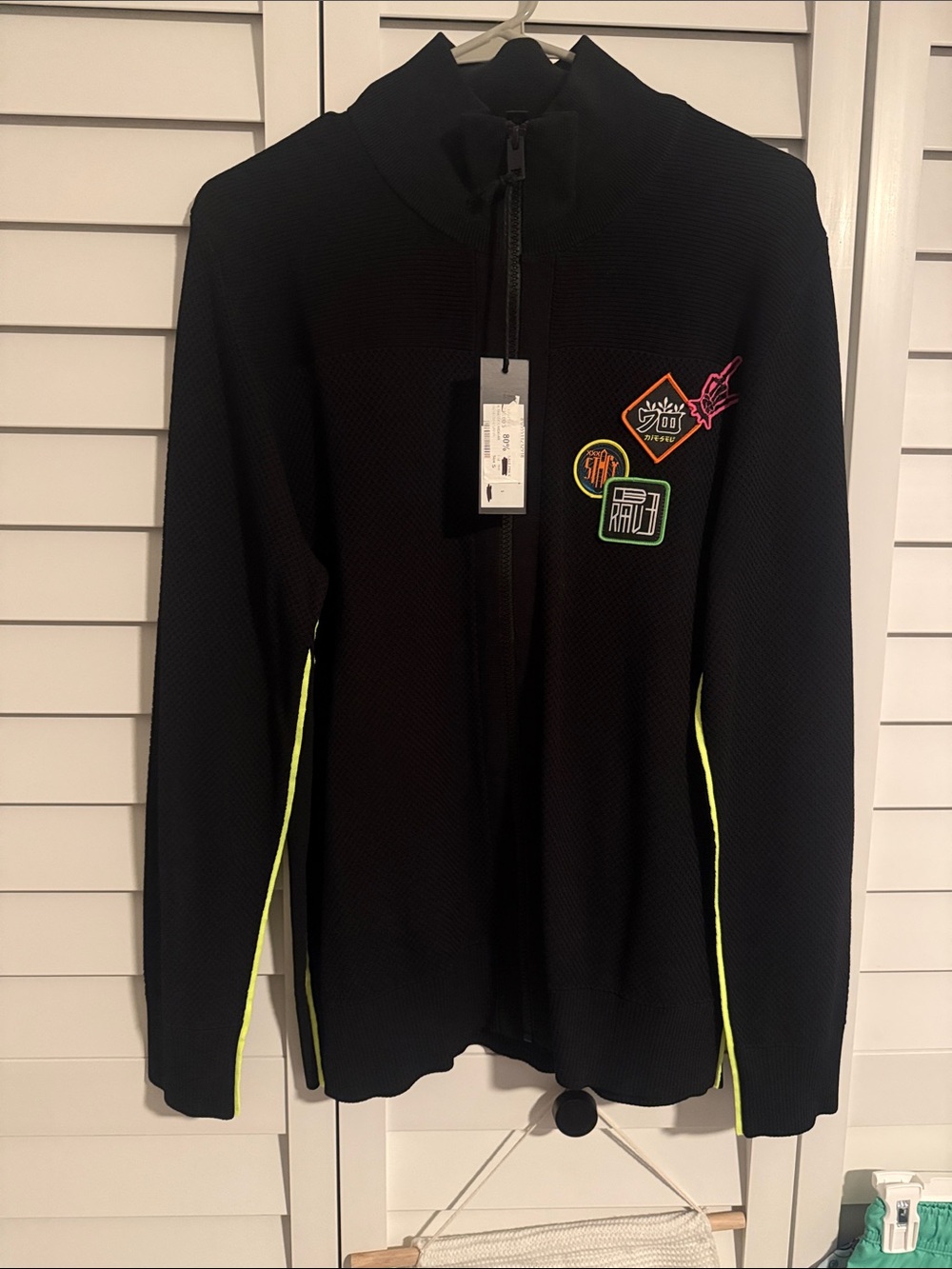 Black Zip-Up Jacket with Neon Trim and Patch Details